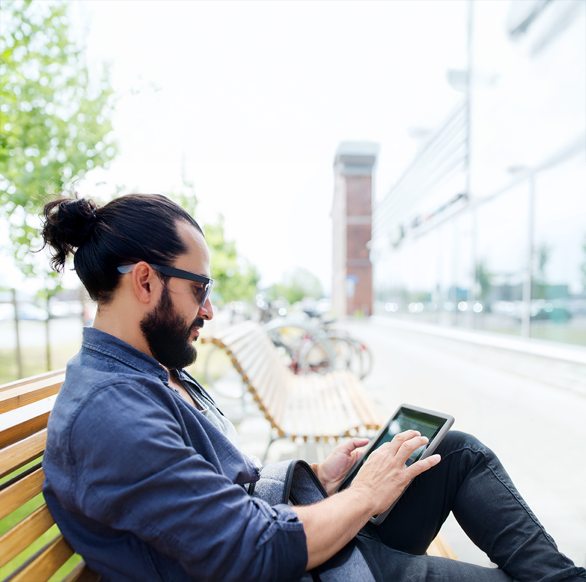 Man with beard using a laptop