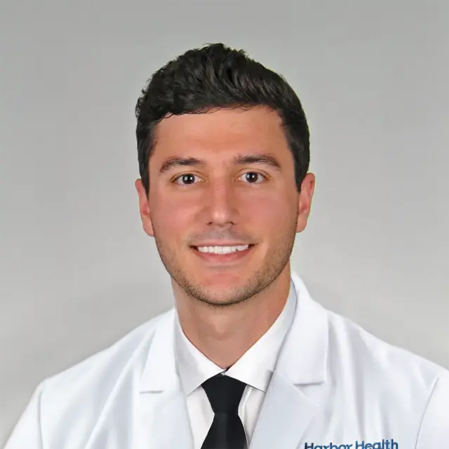 Travis Benzing,  MD