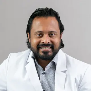 Ajay Zachariah,  MD