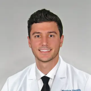 Travis Benzing,  MD
