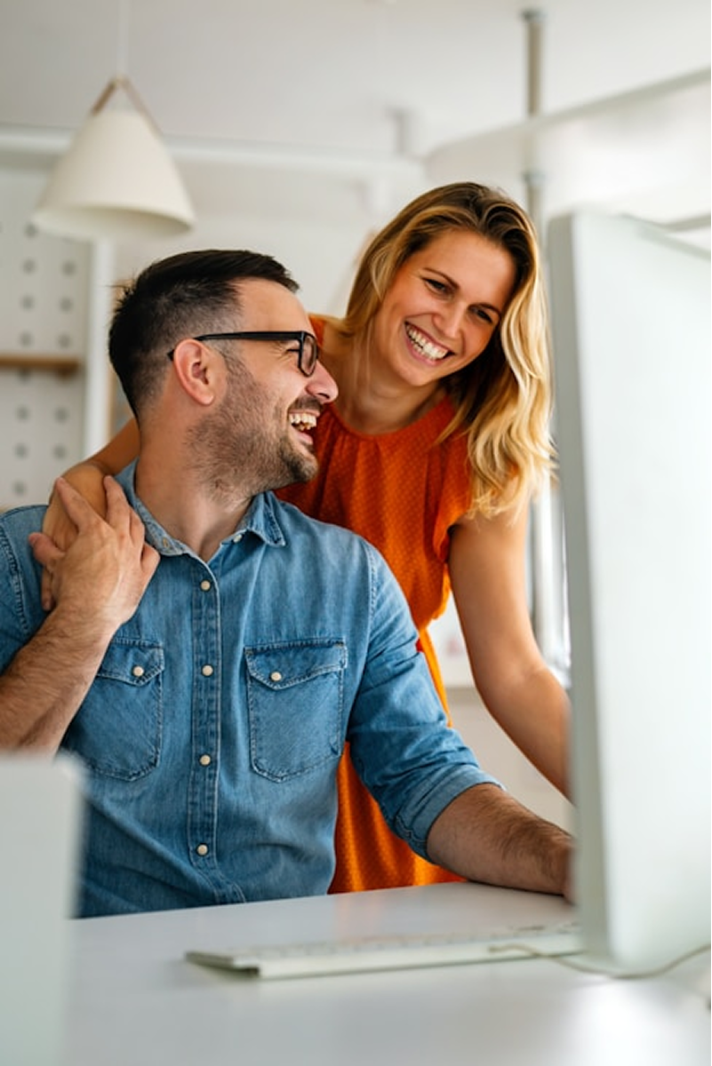 Two people sitting at a computer